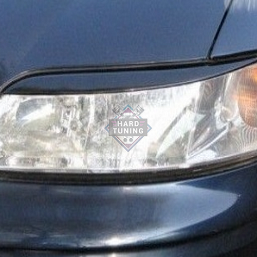 Накладки на фары Opel Vectra B